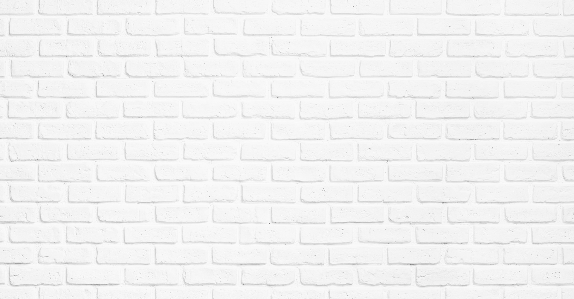 Immagine di un muro di mattoni bianco.